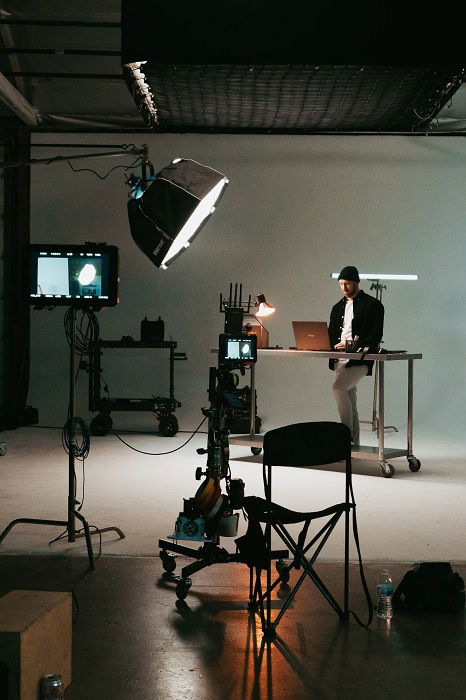 Man editing photos in a photography studio