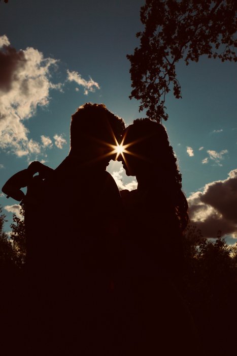 Couple in silhouette with their heads together