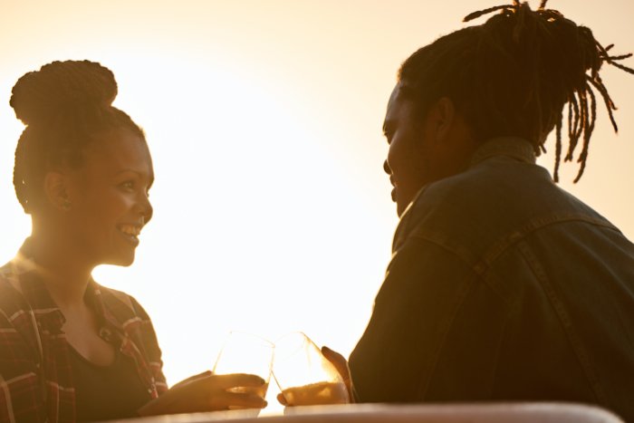 Couple talking to each other in golden hour light