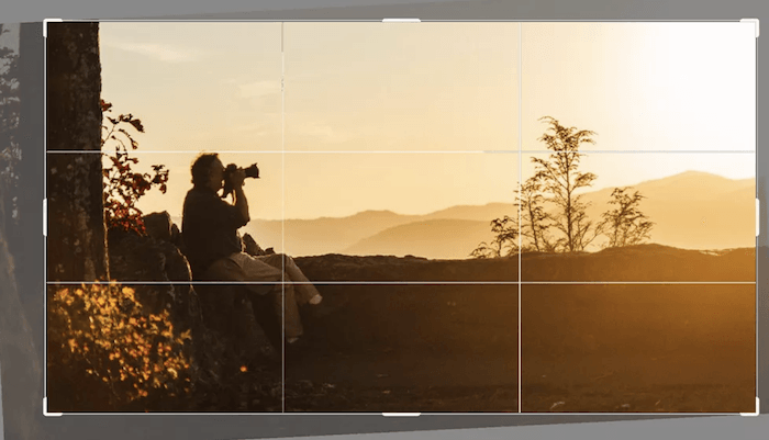 content aware crop of photographer at sunset