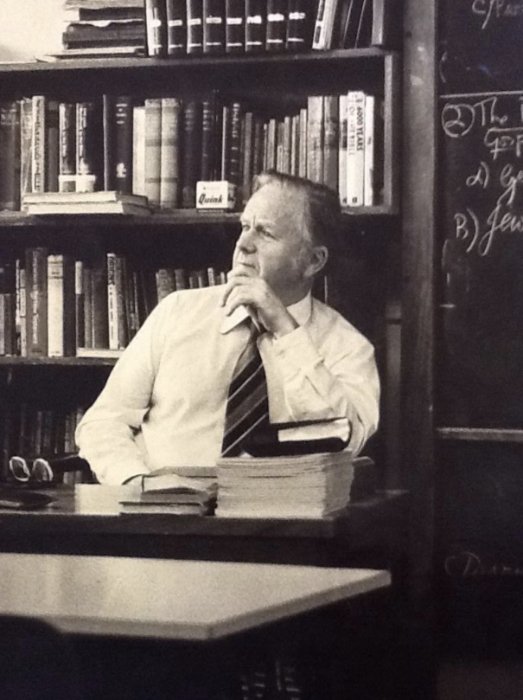 Portrait of a teacher sitting at his desk in the 1980s