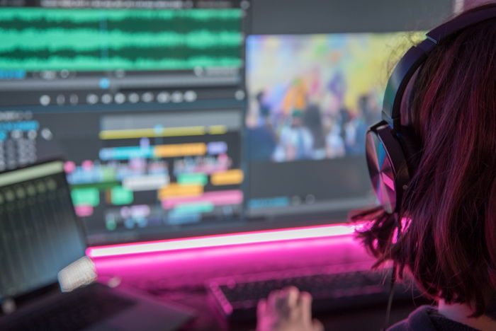 Closeup of man in front of an editing bay