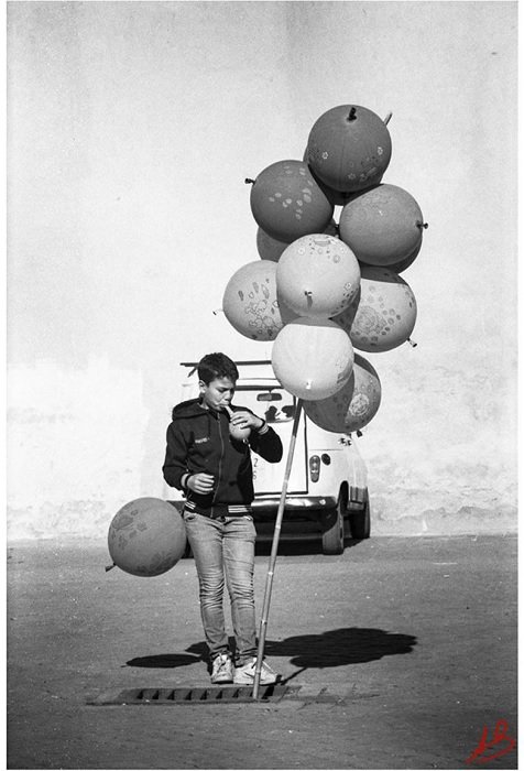 Boy with balloons shot on Rollei Retro 400S
