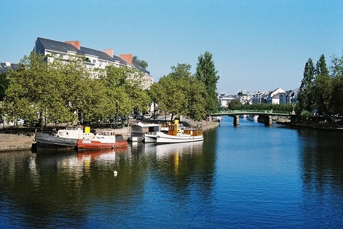 Boats moored by the riverbank in Nantes