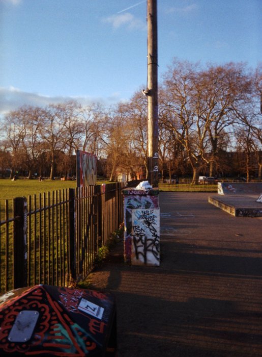 An image of a skatepark during sunset