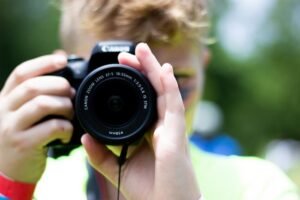 Young lad using a Canon DSLR camera
