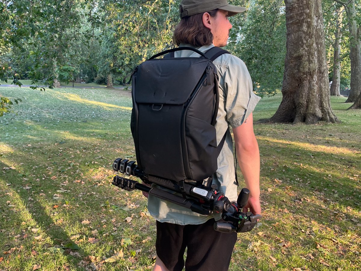 Everyday Backpack V2 being worn with a tripod attached on the bottom