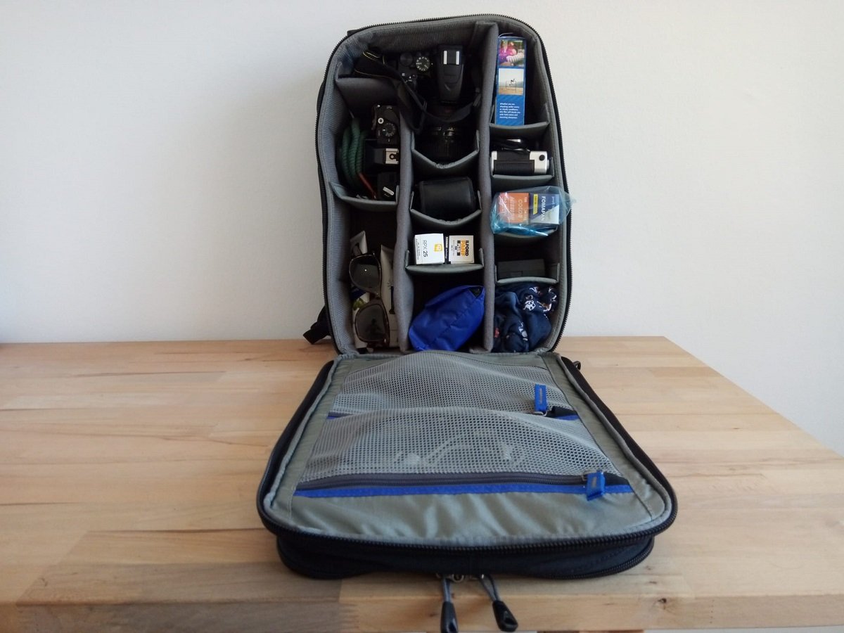 Open backpack full of camera gear