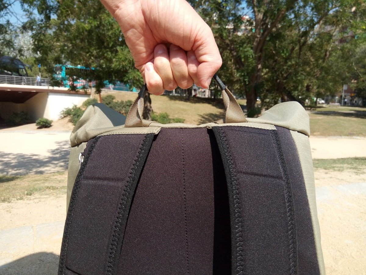Bag being held by top handle