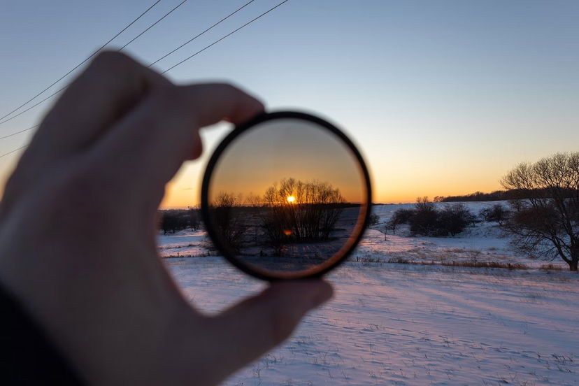 Hand holding an ND filter in front of the camera