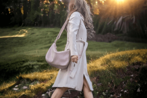 Woman carrying a camera bag purse