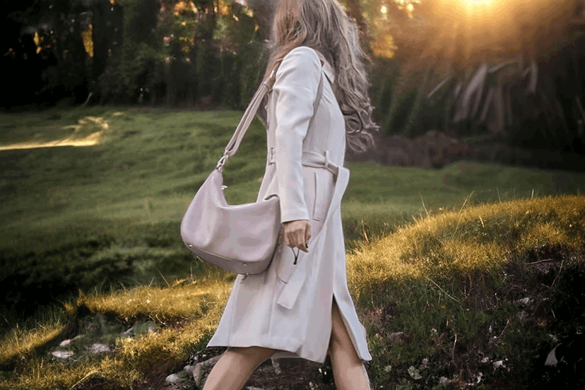 Woman carrying a camera bag purse