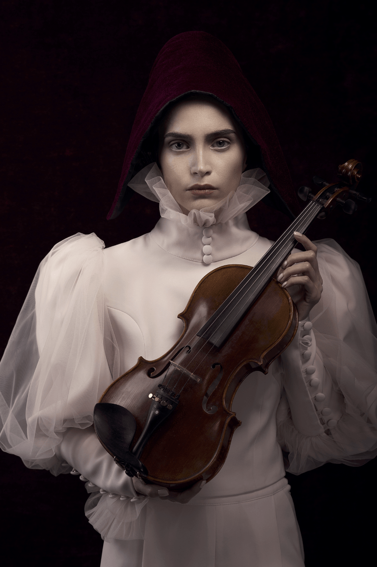 A portrait of a woman holding a violin