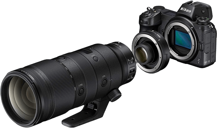 Product photo of a Nikon telephoto lens, teleconverter, and camera body