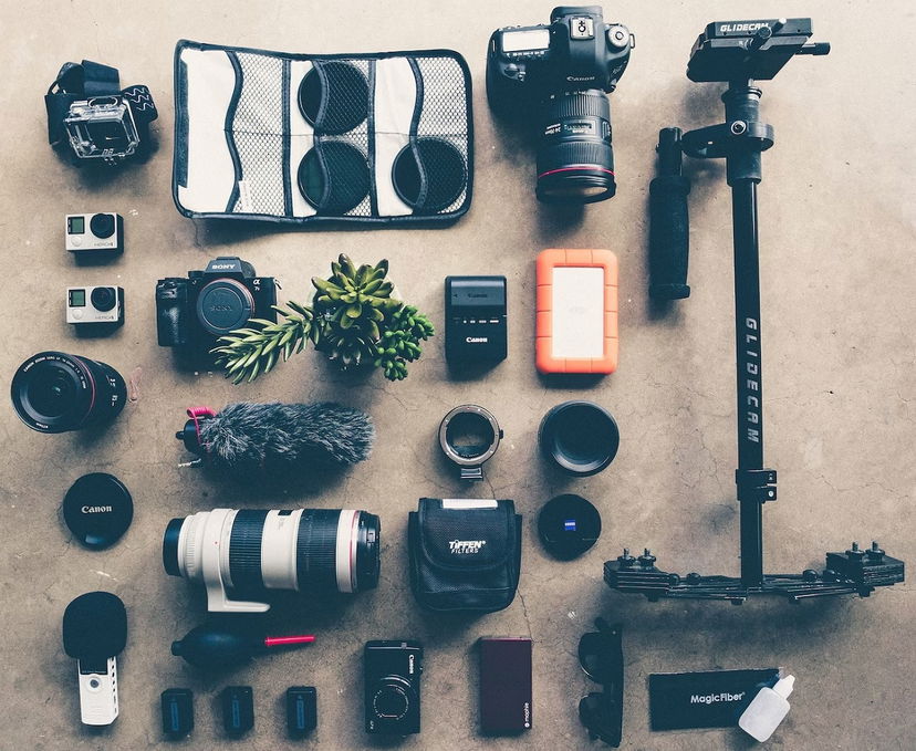 Full set of camera accessories laid out on the floor