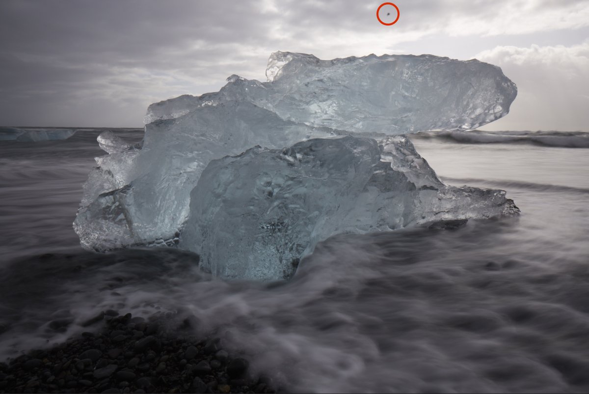 Dust particle highlighted in ice floe image