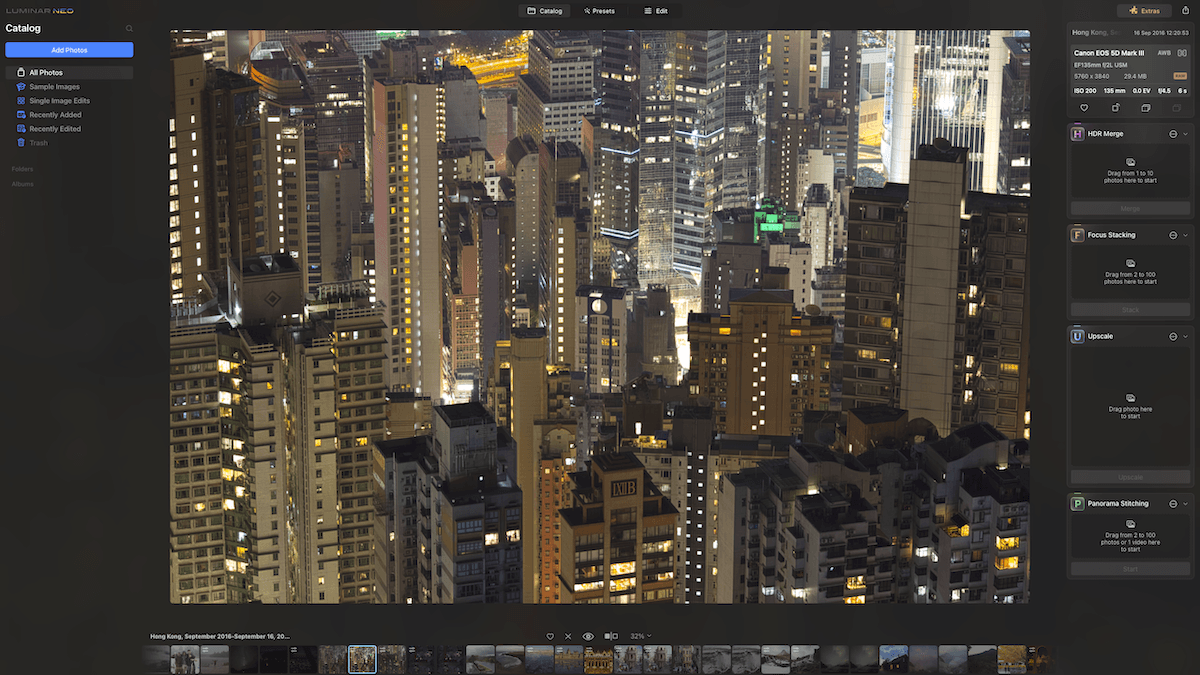 Screenshot of Luminar Neo software interface with a full-screen cityscape image of lit buildings at night