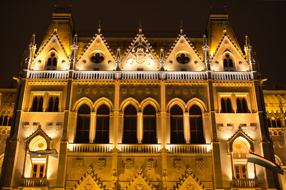 RAW image of building facade lit up with lights at night