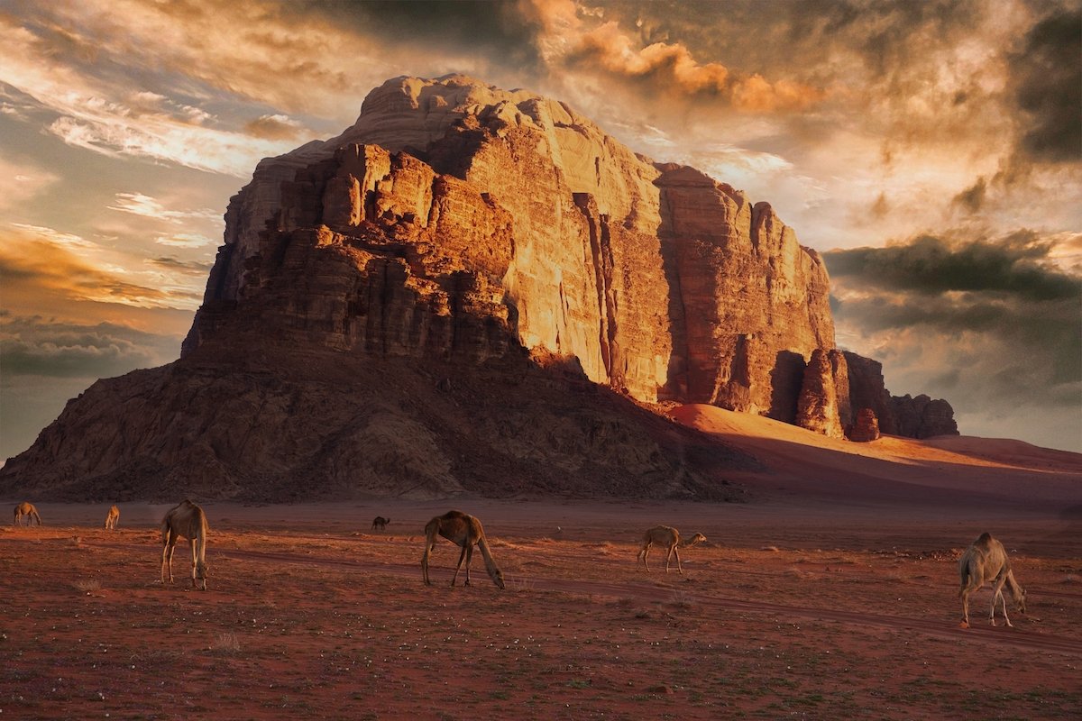 ON1 edited landscape image of desert rock formation and camels