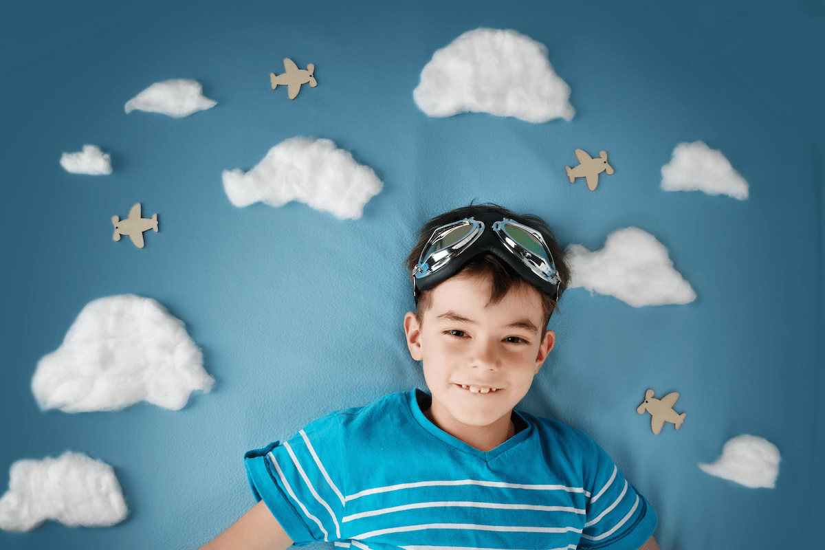 Photo of a boy in front of a homemade photo backdrop