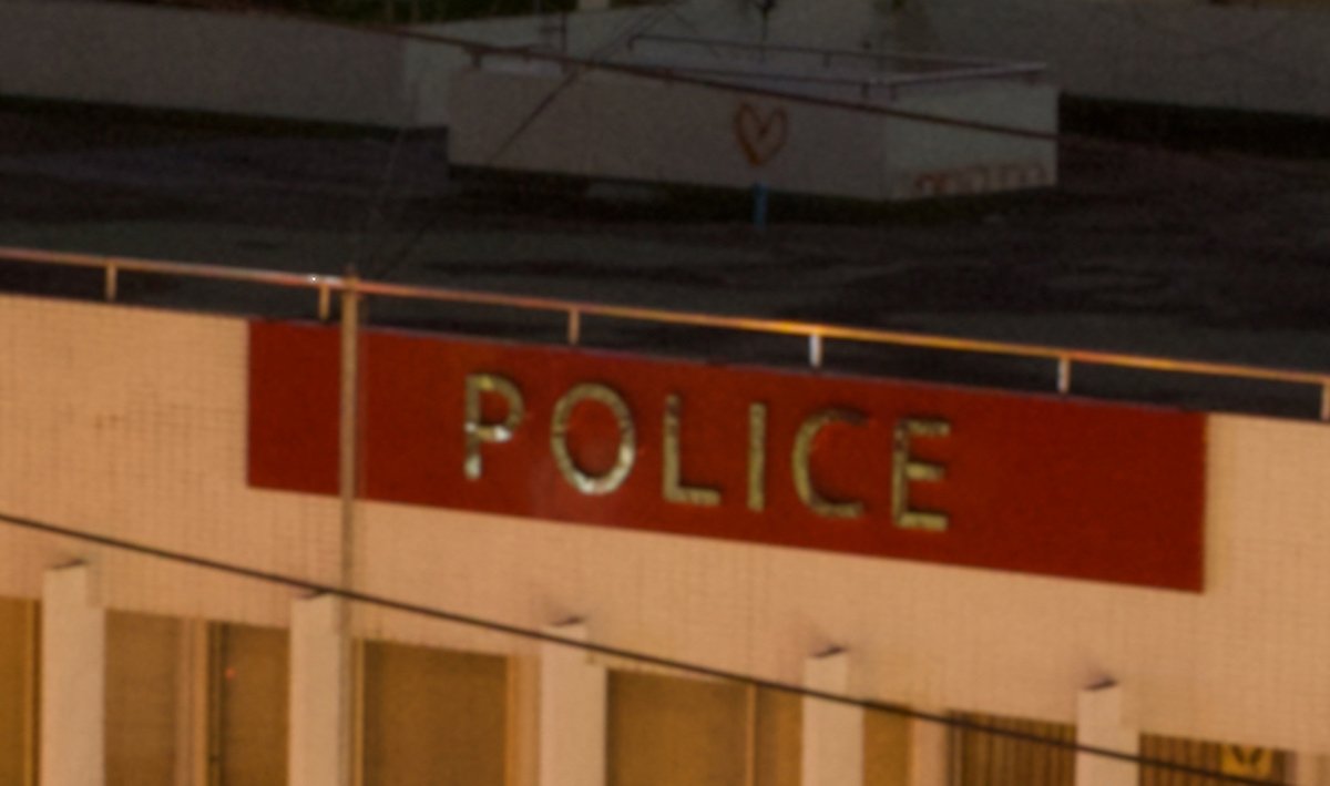 cropped image of police building in Bangkok with noise reduction on inPixio