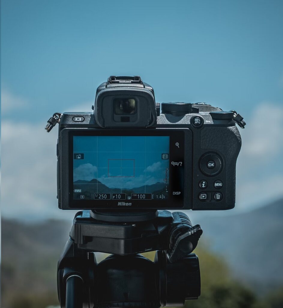 Nikon Z50 mounted on a tripod taking a landscape image