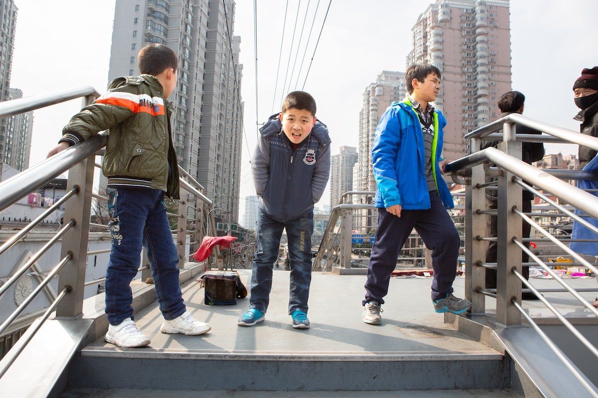 photograph of three kids on a bridge edited