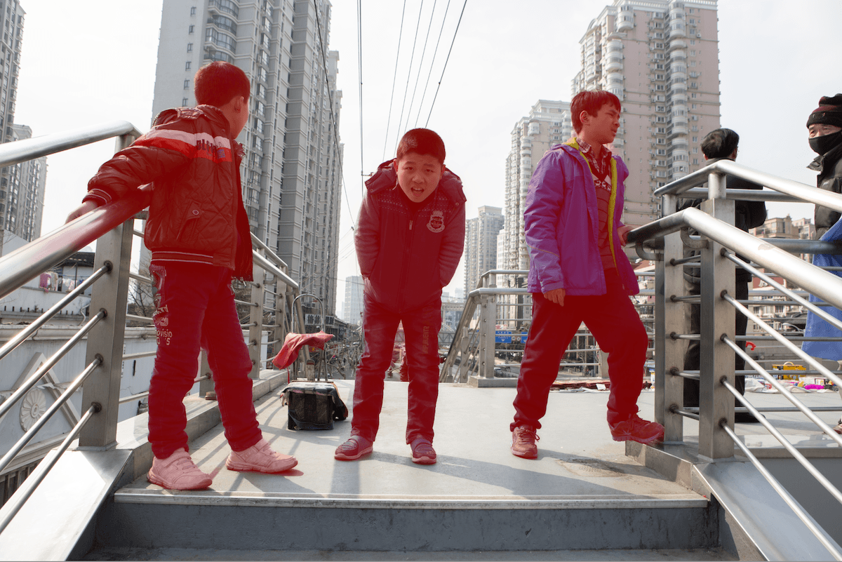 photograph of three kids on a bridge with a mask over the kids in lightroom
