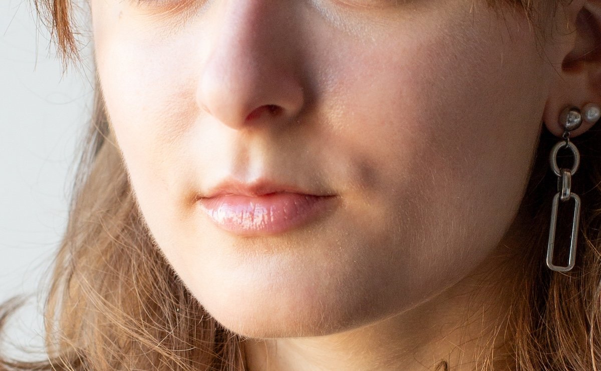 Crop of portrait of a woman with blemishes removed