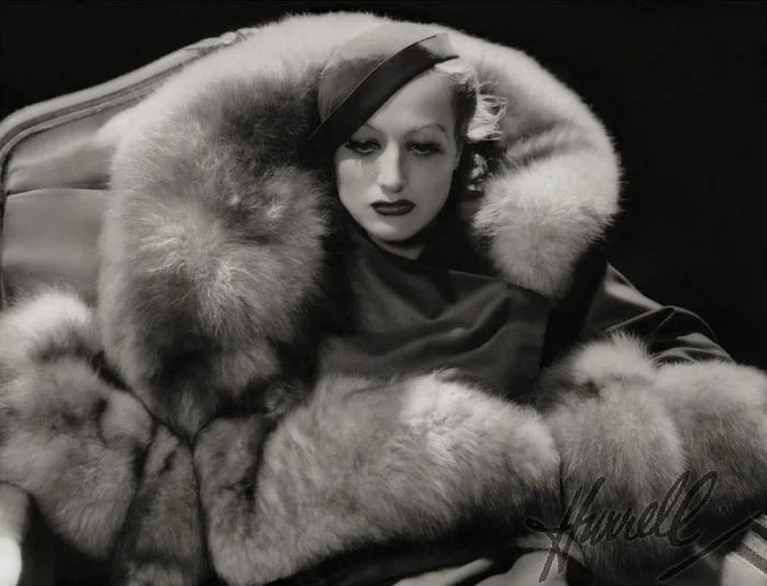 Classic images of Joan Crawford in a massive fur coat