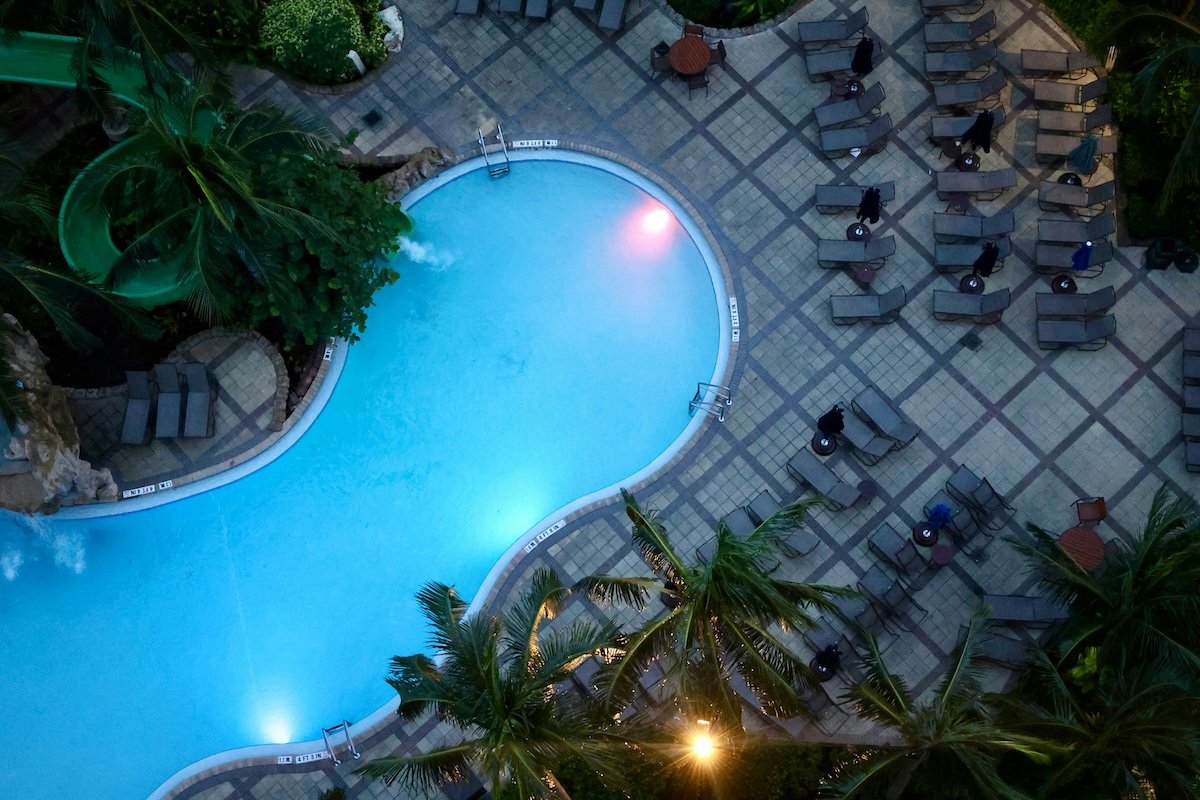 A swimming pool and lounge area shot from above with a lightweight camera