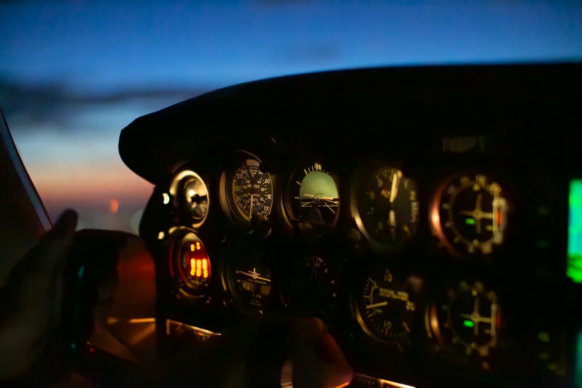 photograph of a cockpit of a plane at night with lightroom denoise