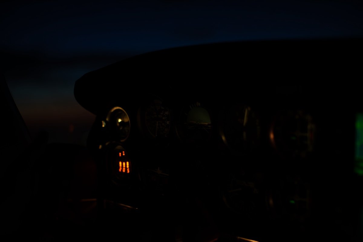 underexposed image of a cockpit at night