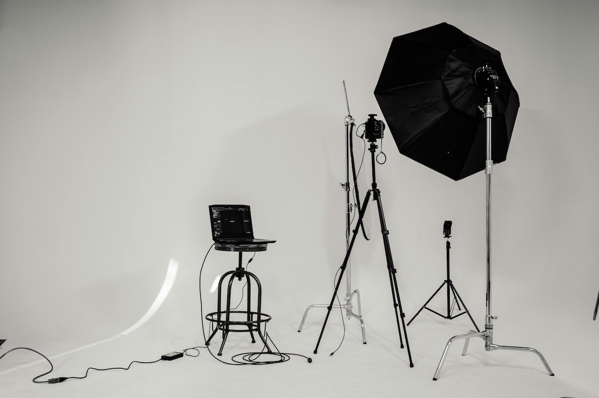 shot of a photo studio with lights, computer and a camera on a tripod