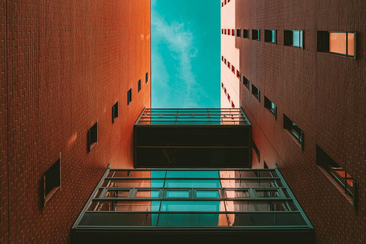 looking up at buildings with teal and orange effect