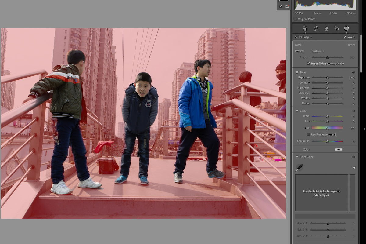 photograph of three boys on a bridge with red around the figures