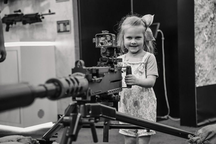 Young girl with a machine gun