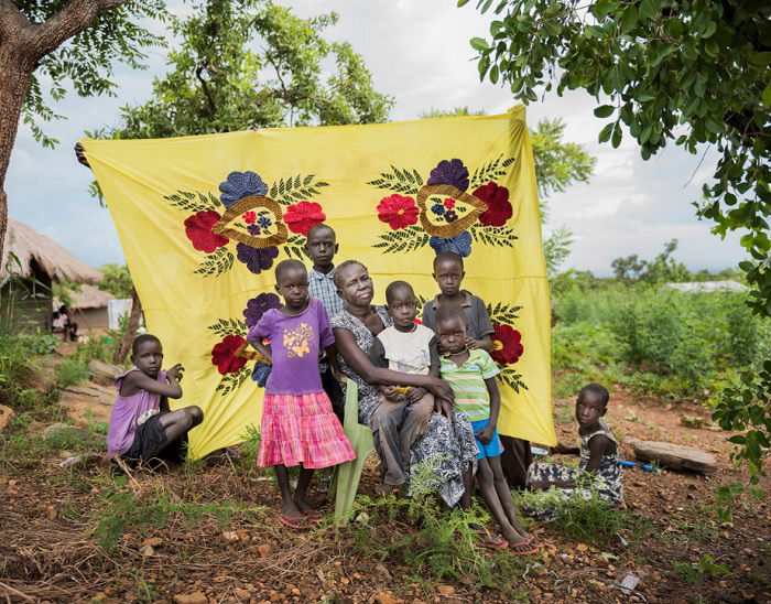 Portrait of African family in front of yellow street