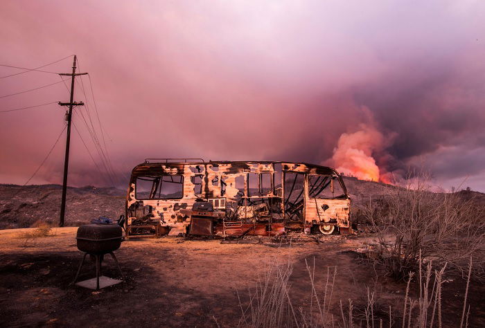 Burnt out bus in the wake of a wildfire