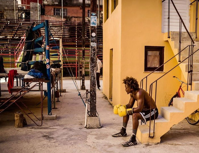 Amateur boxer taking a break on some stairs