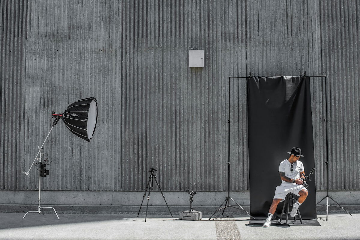 photo of a photoshoot with a studio light and backdrop on location