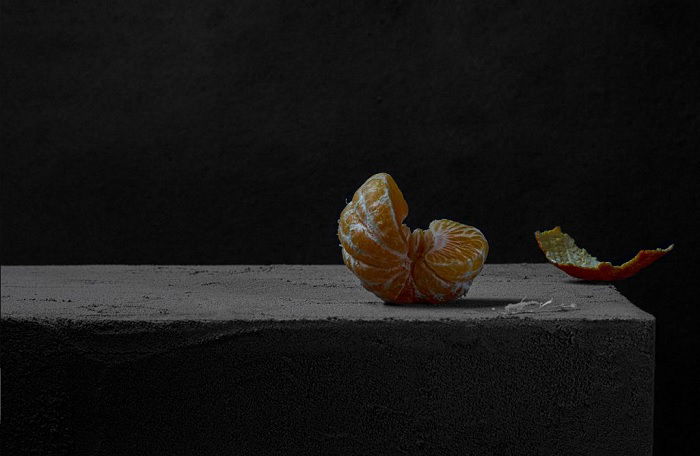 Peeled orange with segments missing