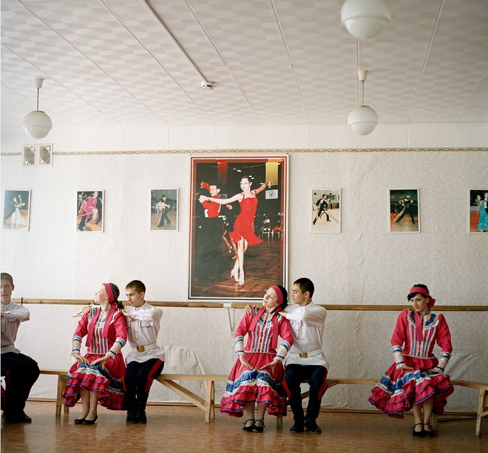 Traditional Cossack Dancers sitting on a bench