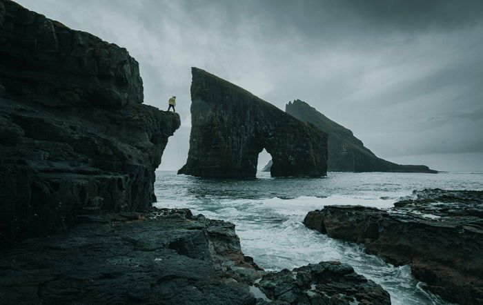 Massive rocky cliffs in a grey sea