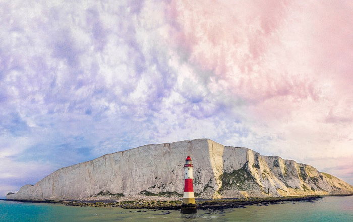 Lighthouse in front of white cliffs