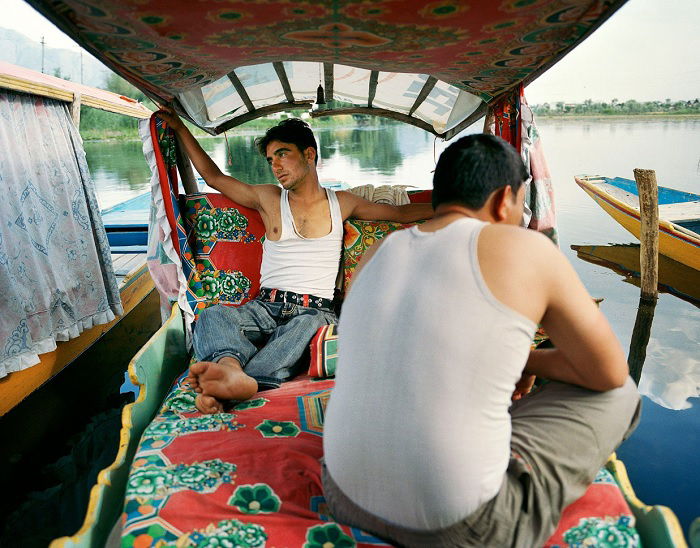 Two men in a river boat