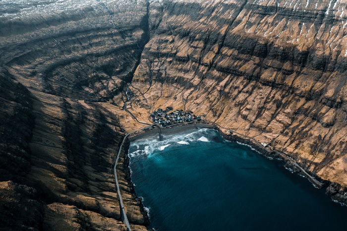 Aerial shot of small village on rocky coast