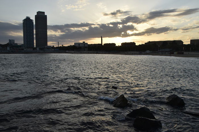 Dark photo of Barcelona coastline