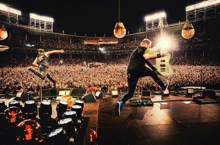 Guitarist jumping during concert