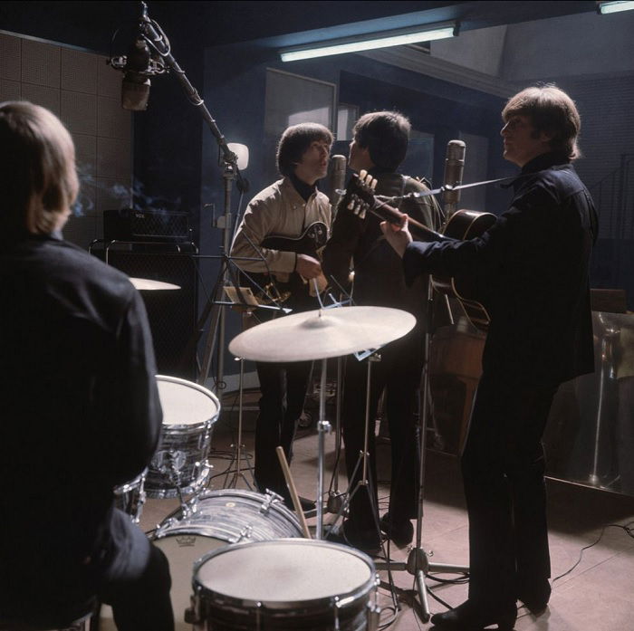 The Beatles performing in the Studio